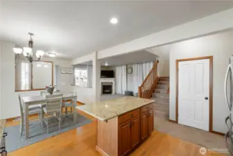 Open the door to see lots of storage space under the stairway. Light provided all the way back and around.