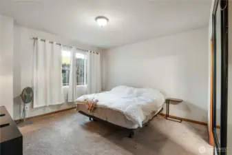 Primary Bedroom. Nice large room. You'll see you can fit a King size bed and plenty of other furniture. Window looks out to private patio.