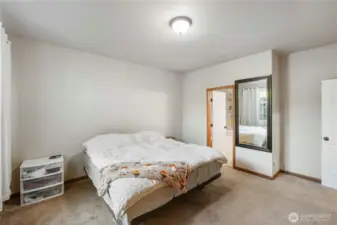 Primary bedroom. Looking to primary bathroom.