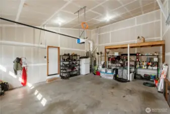Large 2 car garage. And still plenty of other storage room. Freezer stays with the house.
