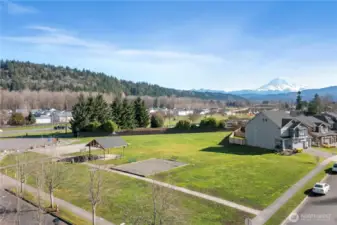 One of the 3 parks in the neighborhood community. Just a couple doors down from your new home. And look at that view of the mountain.