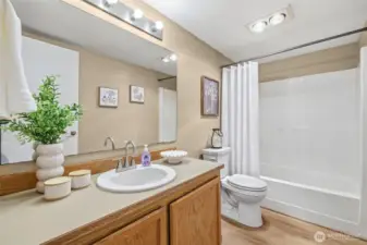 A centrally located full bathroom that works well for both guests and everyday living.