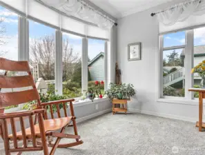 Lots of natural light from these large picture windows make this a great space for plants or soaking in the sun!
