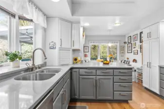 Kitchen is light and bright with a window looking out to your private deck and a breakfast nook that looks out to the creek.