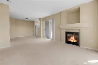 Living area looking back to dining area and kitchen. Also has gas fireplace (HOA paid). un-staged