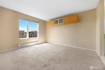 Primary bedroom with tons of natural light and views of City and beyond! un-staged