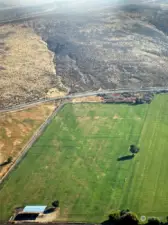 Aerial view from Bare Road, looking east.  Tree in the middle is roughly the property line.  The canal is behind.