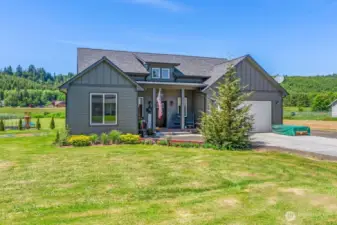 Welcoming covered porch will greet your guests...