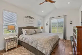 Welcome to the main suite! Vaulted ceilings, gorgeous floors continue, territorial views to gaze at through more beautiful windows (great blinds and window treatments throughout!). Check out the oversized sconce-lighting and another one of those sleek ceiling fans! Enjoy lots of placement opportunities for large furnishings with extra breathing room.
