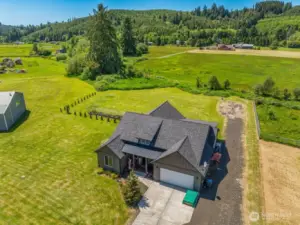 Birdseye view of this lovely acre with creek along the west boundary and peaceful territorial views.