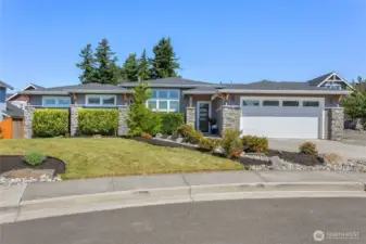Welcome to 6072 Monument Drive!  Lots of windows with an elegant entrance.