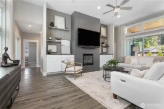 Tiled fireplace from floor to 12 foot ceiling makes this home feel grand!
