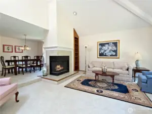A wood-burning fireplace divides the living room and formal dining room.