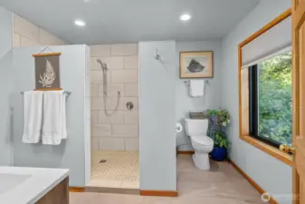Luxury Owner Suite bathroom with dual vanities, oversized walk-in shower with dual showerheads. You even have views from the toilet in this bathroom.