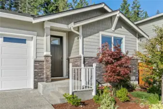 The professionally landscaped front yard is easy-care and drought tolerant.