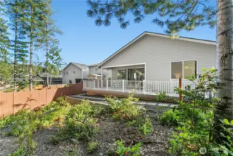 Looking back toward the house you can see the retaining wall and beautiful patio with railing.