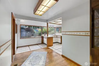 Dining area with kitchen on right