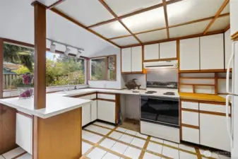 Kitchen with area for barstools on left