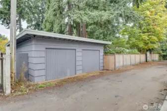 Detached garage with single door that opens to easement off 25th Ave.