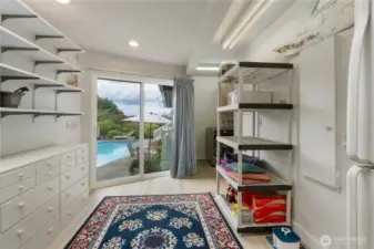 Huge mudroom/laundry room with a bathroom (with shower) when you come out of the pool!