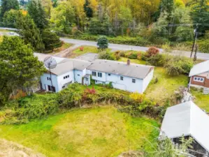 Bird’s-eye view showcasing the home’s private setting among mature trees.
