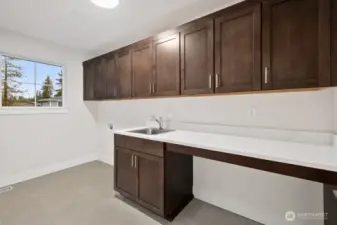 Laundry room with plenty of storage.