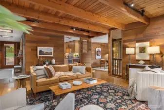 A covered porch and glass door at left offers a welcoming entry for guest as they enter the warm foyer and move towards the main living areas, the efficient kitchen at back and dining room with thoughtful pass-through is on your right.