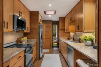 A look at the kitchen from the Living Room to hallway.