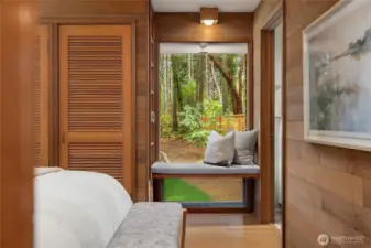 Bedroom #2 with Window seat and generous closet. Door to right leads to laundry room.