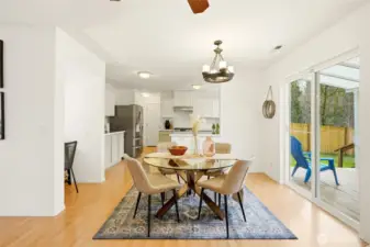 Generous dining space for both daily meals and gatherings. Open sightlines keep the space feeling connected.