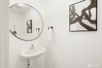 Spacious main-level half bath for guests and everyday convenience