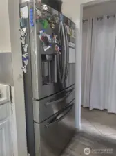 Large fridge with ice and water.