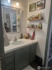 Main bathroom also has two sinks/cabinets on each side. Shower/tub combo.