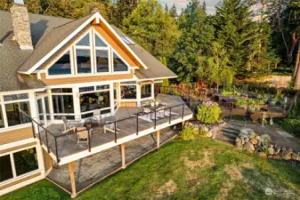 Expansive windows capture the region’s breathtaking views, while the interior layout emphasizes comfort and flow. This home embodies the spirit of the Pacific Northwest, offering a serene retreat with stylish design elements that complement its natural environment.