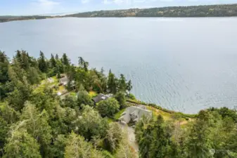 You have your own waterfront lawn for those special moments that you can only get on your private waterfront. This could all be yours—a special place on a private 7-acre wooded wonderland with fantastic views of the Puget Sound and Olympic Mountains, along with your own private beach.