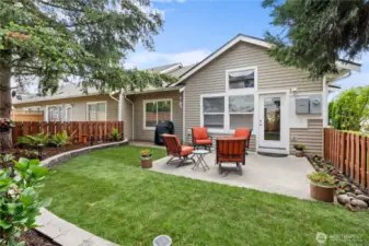 Meticulously landscaped and fully fenced for both beauty and privacy