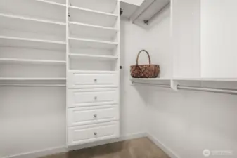 Organize in style, spacious walk-in closet in the primary bedroom, thoughtfully outfitted with California Closets built-ins for effortless storage.