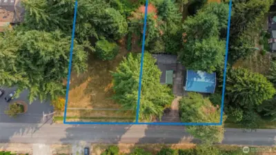 Approximate lot lines shown. The home and shop are on the right. Vacant land is available on the left.