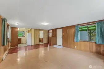 Living and dining room. Looking into kitchen, bath and bedroom.