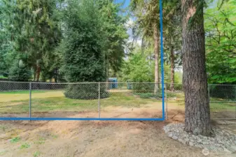 This is a view from the home behind, looking into the backyard.