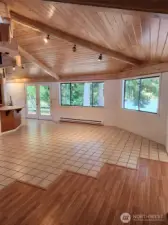 Tile and laminate floors. Cathedral ceilings with custom wood.