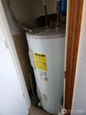 Hot water tank in bathroom closet.