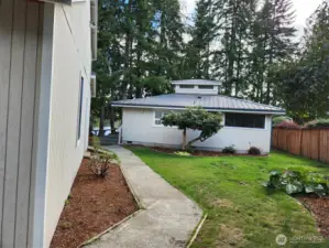 Sidewalk leading to front door.