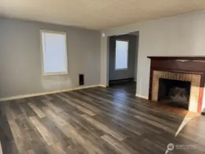 Newer flooring throughout living room and lots of natural light.