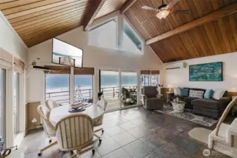 Dining and Living Area full of windows to the water