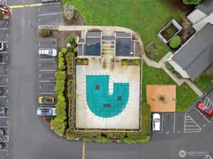 Amenities include an outdoor pool and a clubhouse