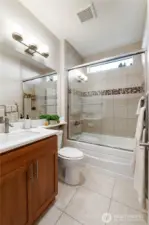 Hall full bathroom with heated towel rack