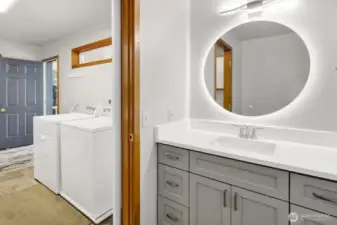 Half bath off utility mud room.