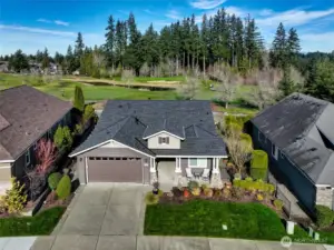 Vashon model home sited on an oversized lot adjacent to the golf course. The long,    widened driveway provides great guest parking or room for an extra vehicle. This home features a covered front porch and extended covered entry way to welcome your guests.