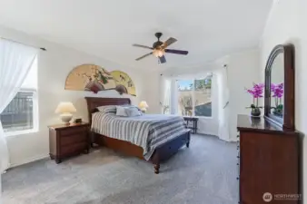 King sized Primary suite w/updated, spa-like bath that includes a dual sink vanity,   step-in shower, private water closet and large walk-in closet with organizers.